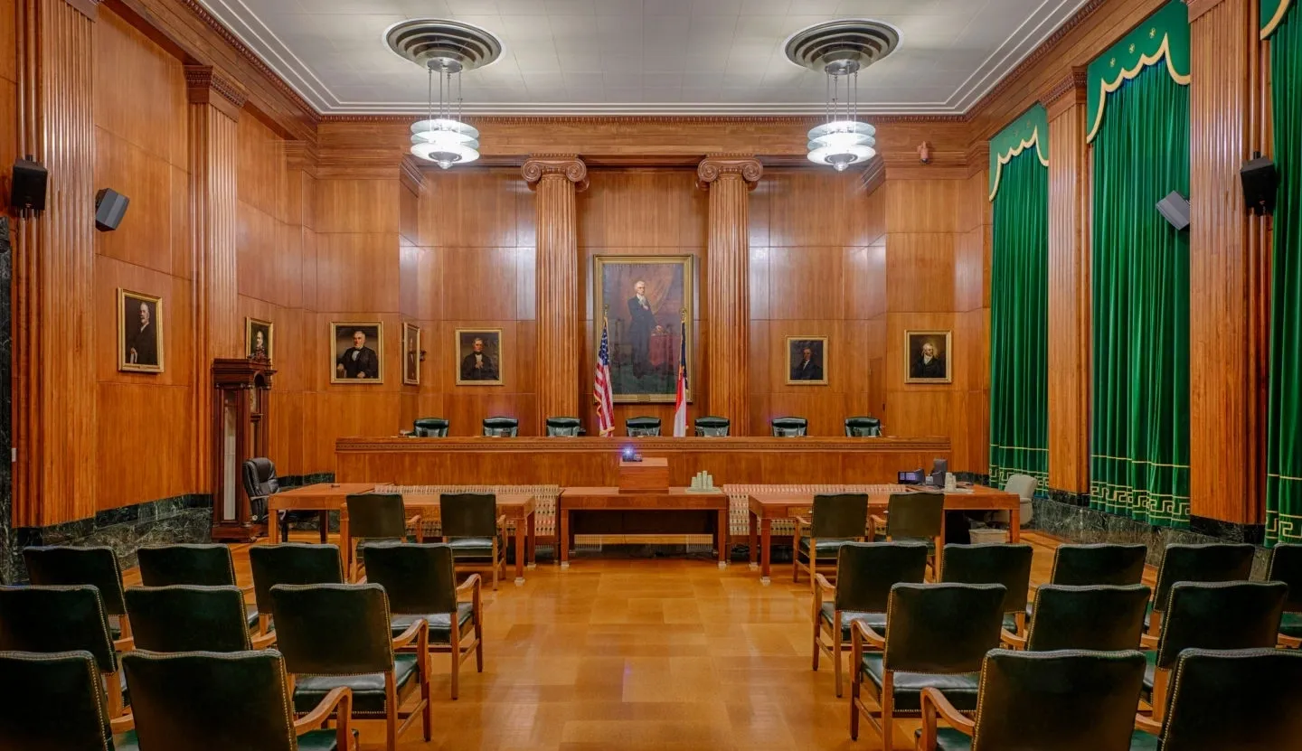 A courtroom with chairs and tables in it